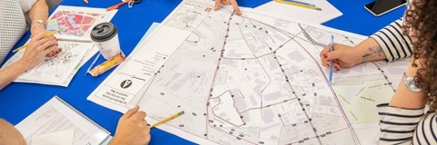 People looking at a plan during Our Future Lancaster public engagement
