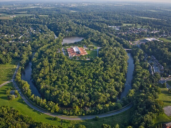 Aerial image of the Sunnyside Peninsula in Lancaster City. Showing the Conestoga River and forest.